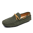 Men’s casual loafers in stylish green suede with contrasting tan laces, offering comfort and elegance.