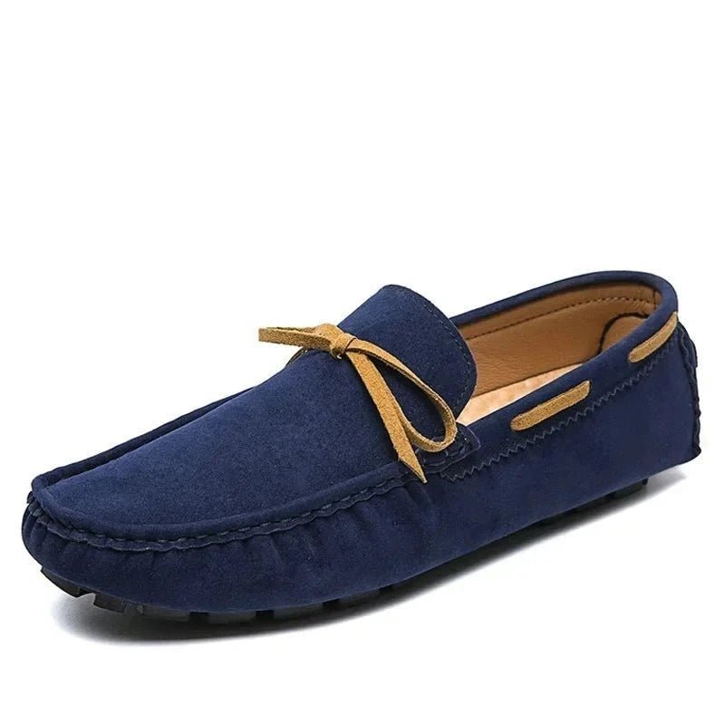 Men’s casual slip-on loafers in navy with a tan bow, showcasing style & comfort