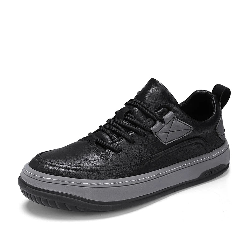 Men’s leather sneakers in black with a sleek low-top design, lace-up closure, and a thick white sole.