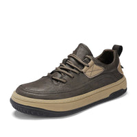 Men’s leather sneakers in brown with detailed stitching and beige sole on a white backdrop.
