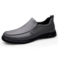 Men’s moccasins shoes in grey, slip-on style with sleek design, displayed against a white background