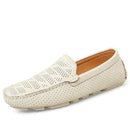 Beige slip-on men’s loafers with perforated design and white soles, ideal for casual wear