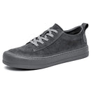 Gray men’s casual leather shoes with laces, displayed on a clean white background.