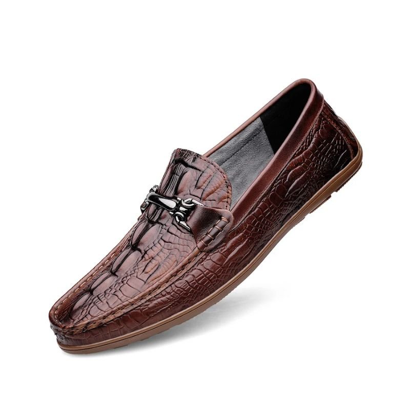 Men’s leather loafers, textured pattern, adorned with a metal chain, showcasing elegance and style.”
