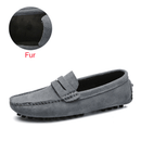 Men’s loafers in grey suede, side view, with comfortable fur lining, showcased against a white background.”
