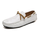 Men’s slip-on loafers in white with textured surface, adorned with a tan leather tie, on a white background