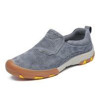 Comfortable Men’s slip-on sneakers in gray suede with elastic side panels and rubber soles.
