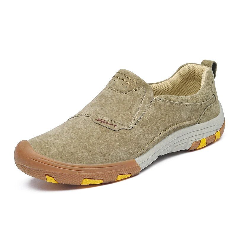 Men’s slip-on sneakers in beige suede with white soles and yellow accents, perfect for stylish comfort.