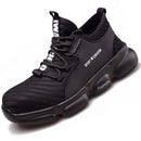 Sneakers work shoes: Black sporty sneaker with textured design, thick sole, and white text accents