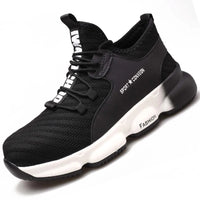 Sneakers work shoes: Black with white soles, marked ‘SPORT X COMFORT’ and ‘FASHION’, blending style & comfort.