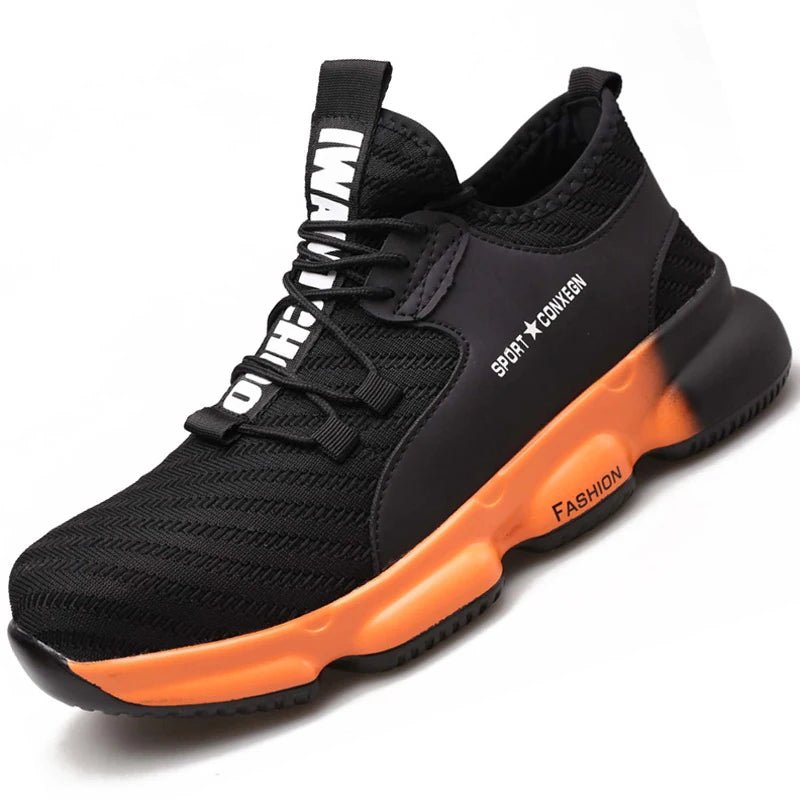 Sneakers work shoes: Stylish black sneaker with orange sole, labeled ‘FASHION’ and ‘SPORT + COMFORT’, featuring a pull tab