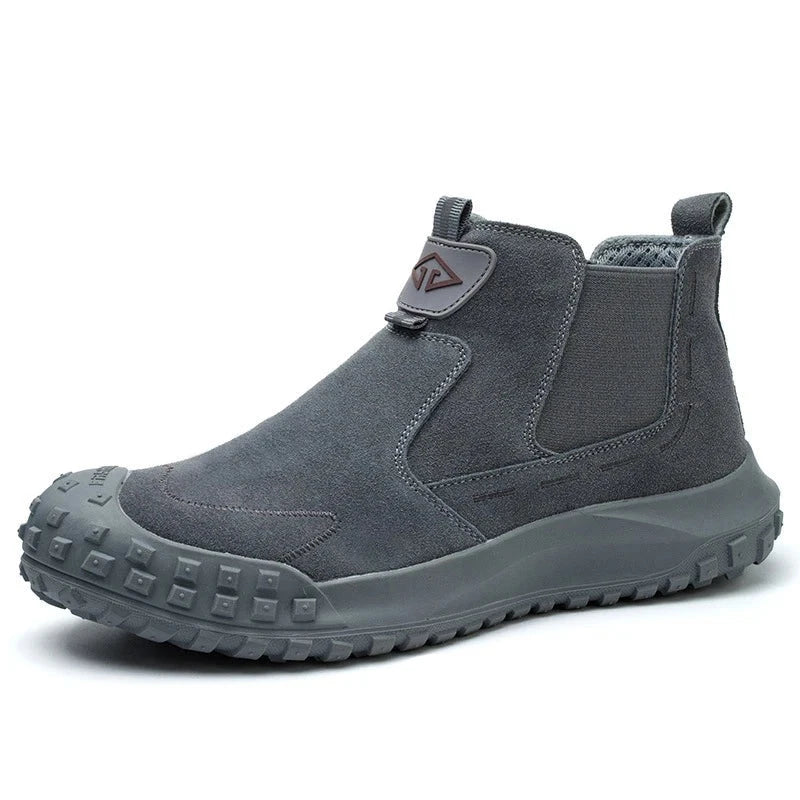 Grey Welder boots with sturdy sole and logo, symbolizing durability and functionality
